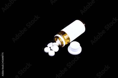 Photo: Suplements pills on the table with dose Suplements pills on the table with dose