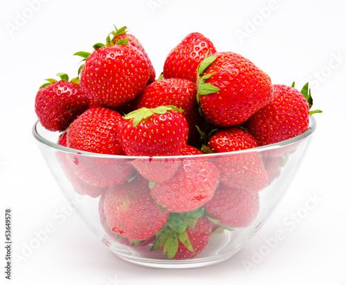 Photo: Red strawberry in the bowl isolated on white Red strawberry in the bowl isolated on white