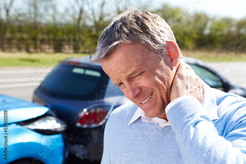Photo: Driver Suffering From Whiplash After Traffic Collision Driver Suffering From Whiplash After Traffic Collision