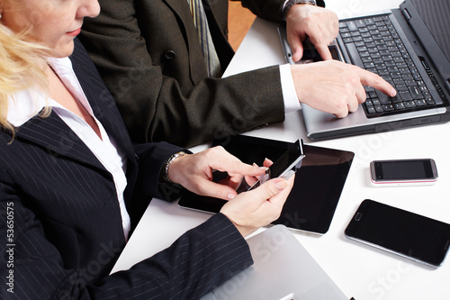 Photo: Business people group working with laptop. Business people group working with laptop.
