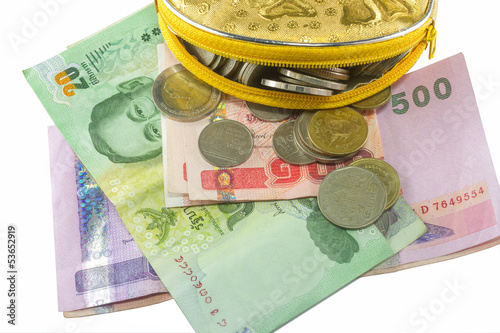 Photo: yellow wallet with Thai Paper Currency on the white background yellow wallet with Thai Paper Currency on the white background