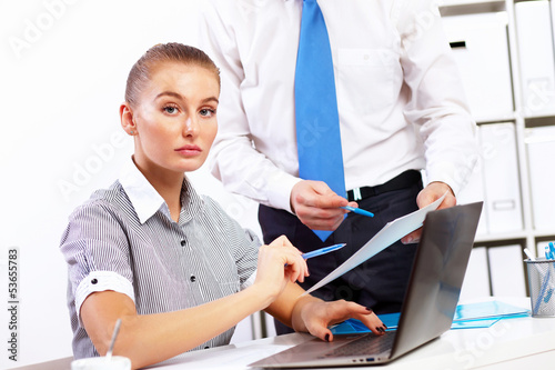 Photo: Business woman in office Business woman in office