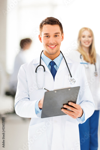 Photo: male doctor writing prescription male doctor writing prescription