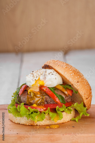 Photo: Hamburger with poached egg and vegetables Hamburger with poached egg and vegetables