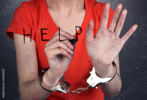 Photo: Prisoner in handcuffs behind glass in soundproof room Prisoner in handcuffs behind glass in soundproof room