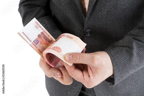 Photo: stack banknotes of 5000 rubles in male hands stack banknotes of 5000 rubles in male hands