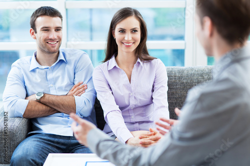 Photo: Couple meeting with financial adviser Couple meeting with financial adviser