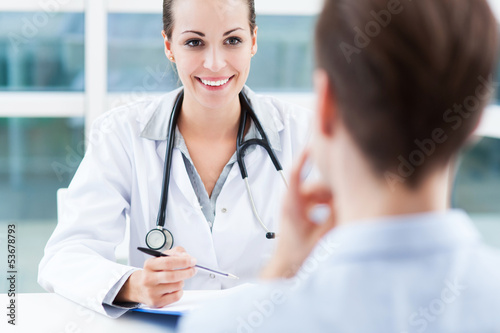 Photo: Female doctor talking to patient Female doctor talking to patient