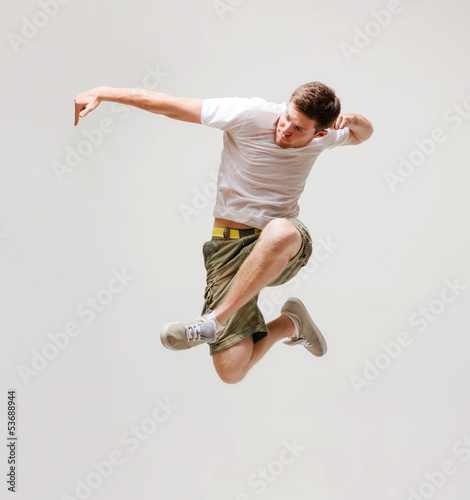 Photo: male dancer jumping in the air male dancer jumping in the air