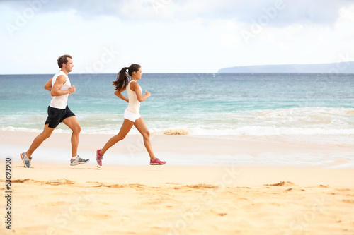 Photo: Running people - woman and man athlete runners Running people - woman and man athlete runners