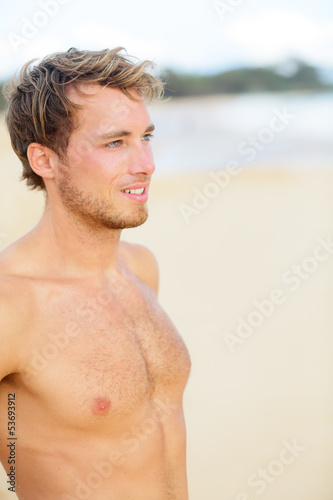 Photo: Beach man looking at ocean Beach man looking at ocean
