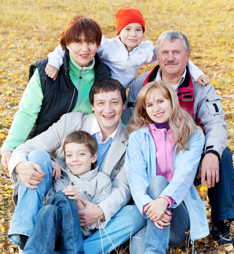 Photo: Big family in autumn park Big family in autumn park