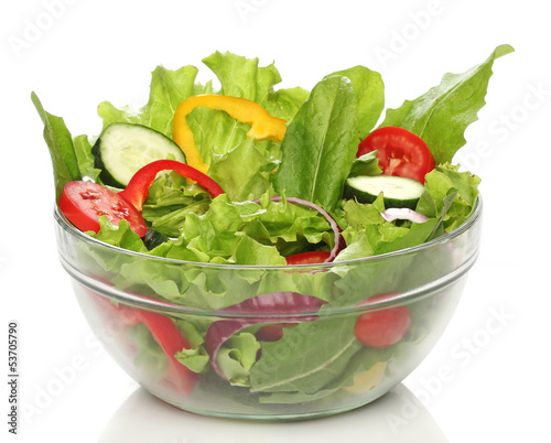 Photo: Delicious salad on a bowl isolated over white Delicious salad on a bowl isolated over white