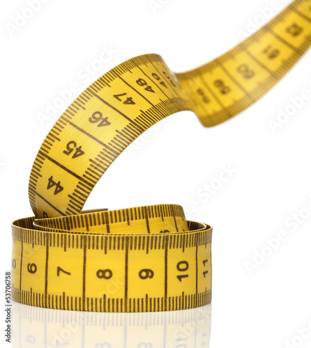 Photo: Measuring tape isolated over white background Measuring tape isolated over white background