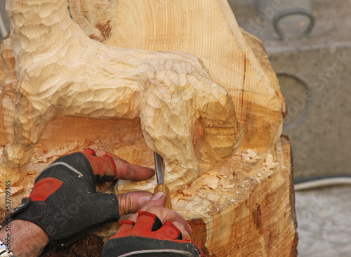 Photo: expert hands with gloves of a craftsman who works with wood expert hands with gloves of a craftsman who works with wood