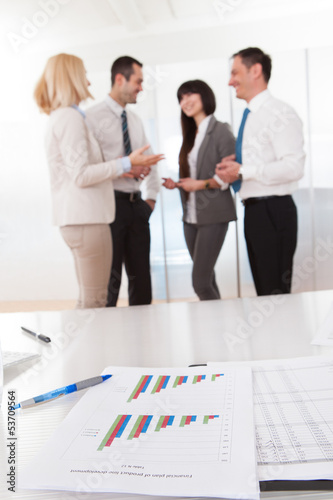 Photo: Business Graph Chart On A Table Business Graph Chart On A Table