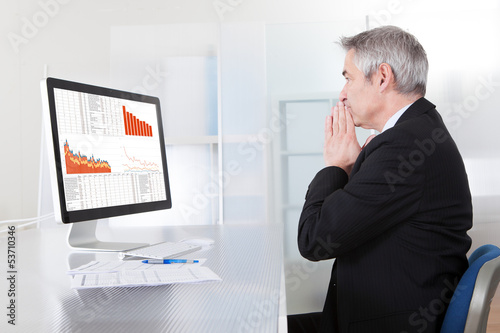 Photo: Confused Businessman With Computer Confused Businessman With Computer