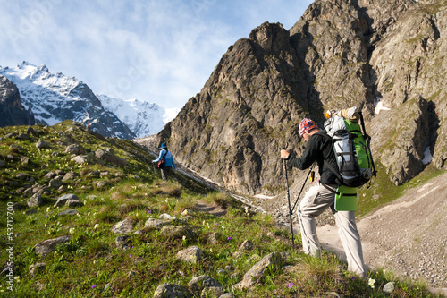 Photo: Hikier is climbing mountain in Caucasus mountains in Bezengi reg Hikier is climbing mountain in Caucasus mountains in Bezengi reg