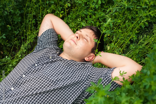Photo: man sleeping on the grass man sleeping on the grass