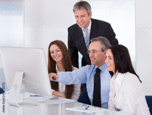 Photo: Happy Business People Working Happy Business People Working