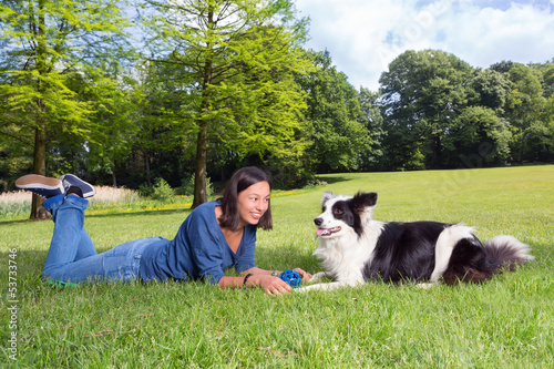 Photo: Playful dog and woman Playful dog and woman