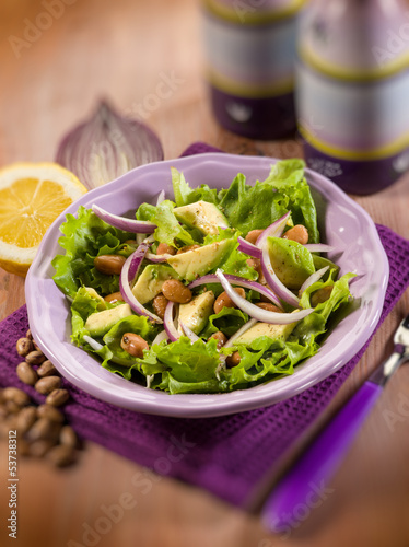 Photo: salad with avocado lettuce beans and onions, selective focus salad with avocado lettuce beans and onions, selective focus