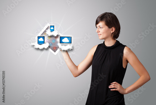 Photo: young woman holding tablet with modern devices in clouds young woman holding tablet with modern devices in clouds