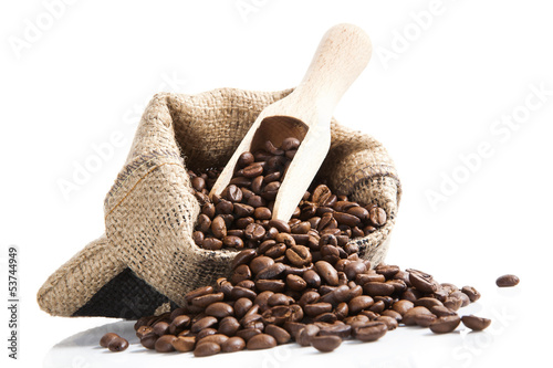 Photo: coffee beans in bag with wooden spoon. coffee beans in bag with wooden spoon.