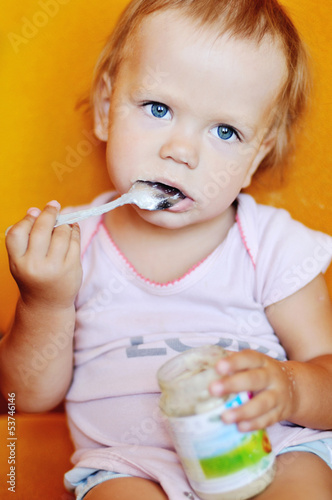 Photo: baby girl eating puree baby girl eating puree