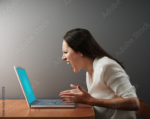 Photo: angry woman with laptop angry woman with laptop