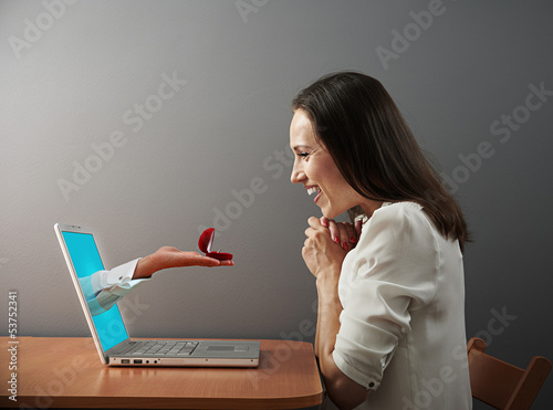 Photo: woman looking at ring woman looking at ring