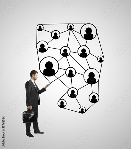 Photo: man standing with phone man standing with phone