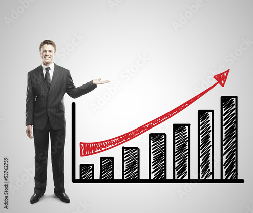 Photo: man shows graph man shows graph