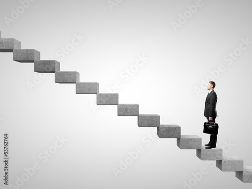 Photo: businessman standing on stairs businessman standing on stairs