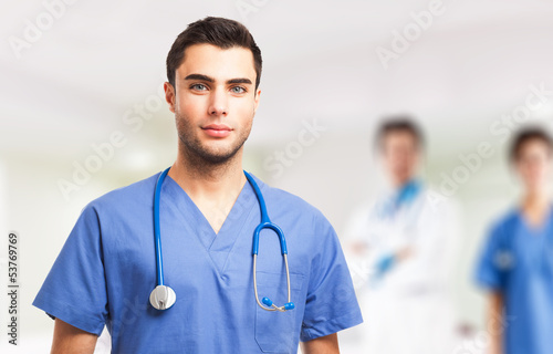 Photo: Doctor in front of his medical team Doctor in front of his medical team