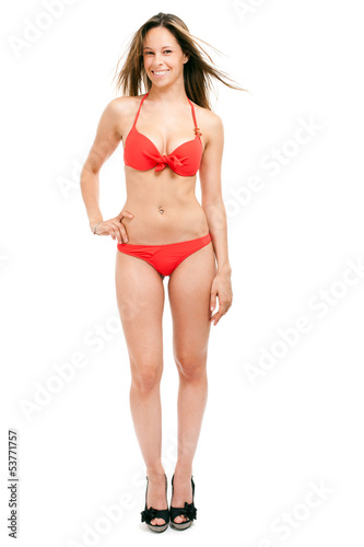 Photo: Full length woman in bikini isolated on white Full length woman in bikini isolated on white