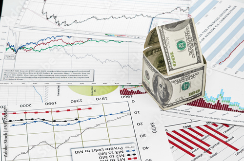 Photo: House of dollars. on chart background House of dollars. on chart background