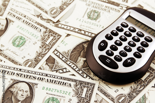 Photo: Calculator and cash Calculator and cash