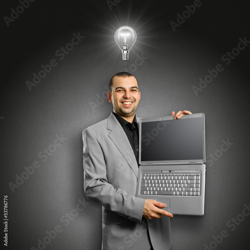 Photo: Idea Concept businessman with open laptop in his hands Idea Concept businessman with open laptop in his hands