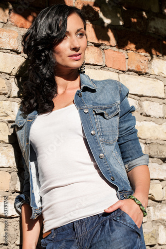 Photo: Beautiful young woman at the bricks Beautiful young woman at the bricks