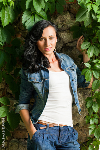Photo: Beautiful young woman in a park Beautiful young woman in a park