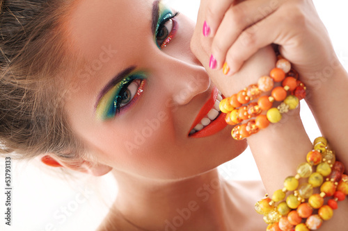 Photo: Beautiful woman with artistic makeup Beautiful woman with artistic makeup