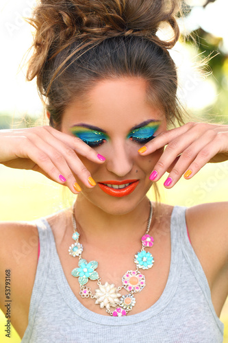 Photo: Beautiful woman with artistic makeup Beautiful woman with artistic makeup