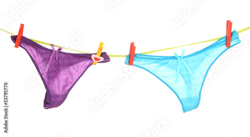 Photo: Women's panties hanging on rope isolated on white Women's panties hanging on rope isolated on white