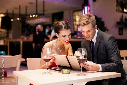 Photo: couple with menu card couple with menu card