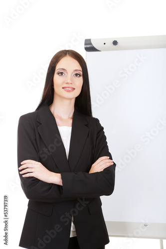 Photo: Businesswoman presenting on whiteboard. Businesswoman presenting on whiteboard.