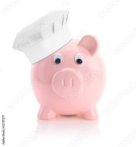Photo: Cooking economy represented by a piggy bank with a chef hat Cooking economy represented by a piggy bank with a chef hat