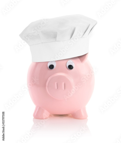 Photo: Cooking economy represented by a piggy bank with a chef hat Cooking economy represented by a piggy bank with a chef hat
