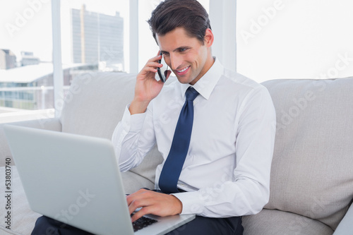 Photo: Handsome businessman on the phone Handsome businessman on the phone
