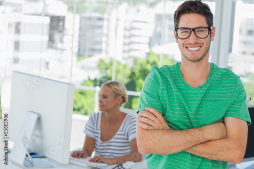 Photo: Attractive designer standing in his office Attractive designer standing in his office